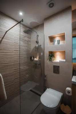 a bathroom with a glass shower with a toilet at Royal Blue Resort & Residences in Tivat