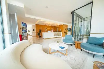 a living room with a couch and a table at Royal Blue Resort & Residences in Tivat
