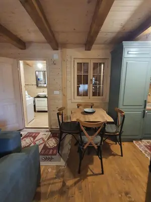 a dining room with a table and chairs in a room at Villa Skyline in Kotor
