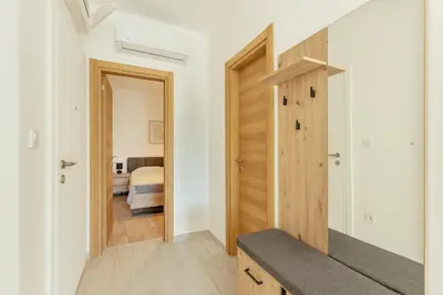 a hallway with a door leading to a bedroom at Apartment Ava in Kotor