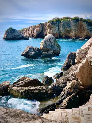 a group of rocks in the water near the ocean at CONTiNUUM in Ulcinj