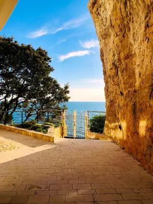 a door to the ocean from a stone wall at CONTiNUUM in Ulcinj