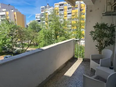 a balcony with chairs and a view of buildings at Serenity City Centre in Podgorica