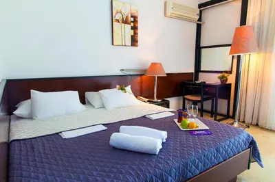 a hotel room with a bed with a tray of fruit on it at CORPUS A - Hotel Albatros in Ulcinj