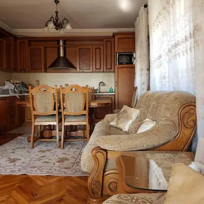 a living room with a couch and a table at City Center Two-Bedroom Apartment in Ulcinj