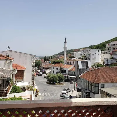 a view of a town with a street and a mosque at City Center Two-Bedroom Apartment in Ulcinj