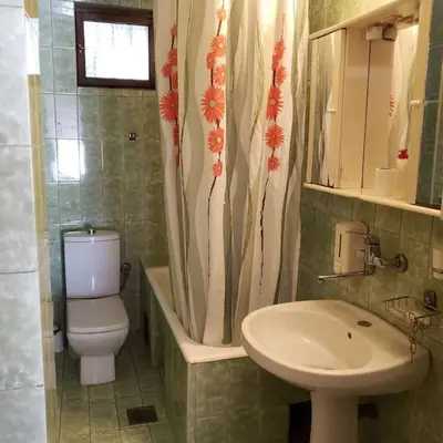 a bathroom with a toilet and a sink at City Center Two-Bedroom Apartment in Ulcinj