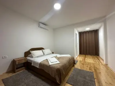 a bedroom with a bed with two towels on it at Gazdinstvo Đurović in Dobra Voda