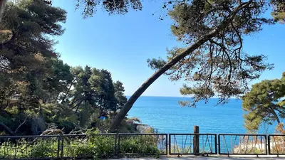 a view of the ocean from behind a fence at Apartman 200 in Ulcinj