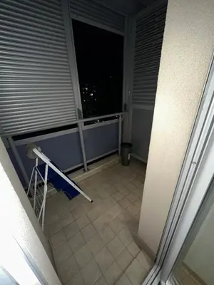 an empty balcony with a view of a night at Laura apartment City kvart in Podgorica