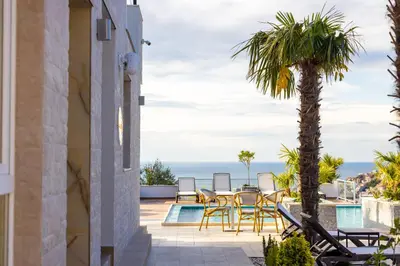 a villa with a view of the ocean at Hotel Reset in Budva