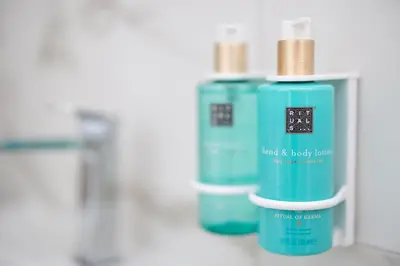 two bottles of moisturizers sitting next to each other at Hotel Reset in Budva