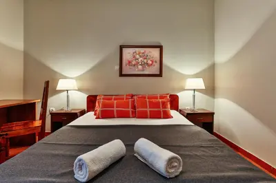 a bedroom with a bed with two pillows on it at Apartments Misko in Utjeha
