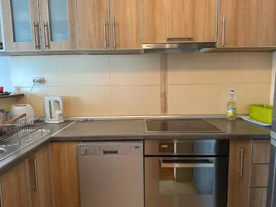 a kitchen with a stove and a dishwasher at Wonder Apartments in Budva