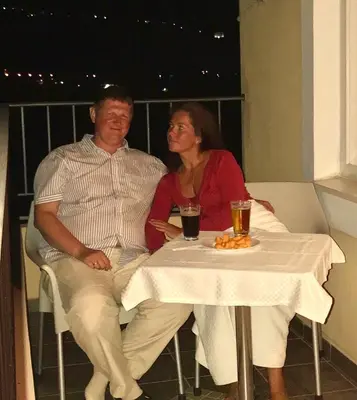 a man and a woman sitting at a table at Apartments Royal in Budva