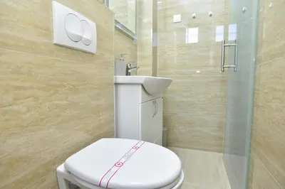 a bathroom with a toilet and a sink at Apartments Royal in Budva