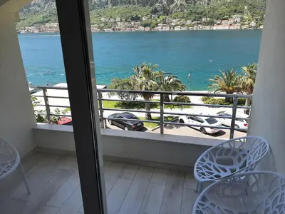 a view of the ocean from a room with a balcony at Luxury flat with amazing view INES in Kotor