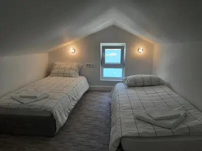 a bedroom with two beds and a window at Luxury flat with amazing view INES in Kotor