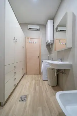 a small bathroom with a sink and a toilet at Apartments Milunović in Kotor
