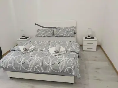 a bedroom with a bed with shoes on it at Apartment Marina 2 in Kotor