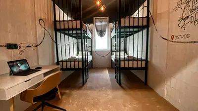 a room with a desk and a laptop in a room with bunk beds at Magic Point in Kruče