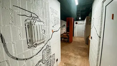 a hallway with a drawing on the wall at Magic Point in Kruče
