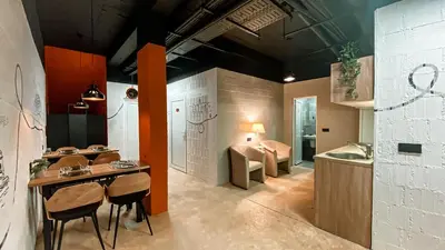 a kitchen with a table and chairs and a sink at Magic Point in Kruče