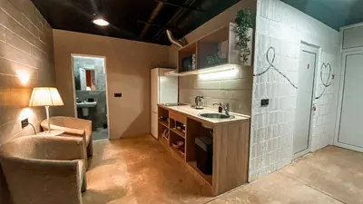 a small kitchen with a sink and a chair at Magic Point in Kruče