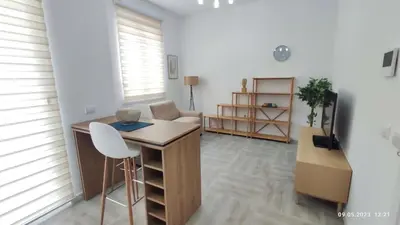 a room with a desk and a chair and a table at Apartments LORA Susanj in Bar