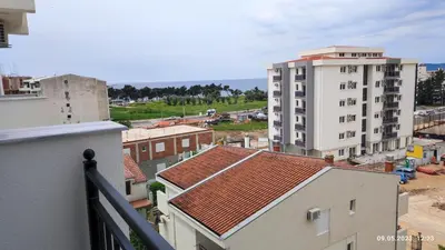 a view of a city from a balcony with buildings at Apartments LORA Susanj in Bar