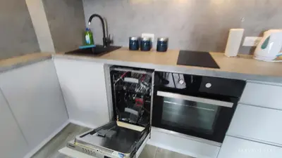 a kitchen with a microwave oven sitting on a counter at Apartments LORA Susanj in Bar
