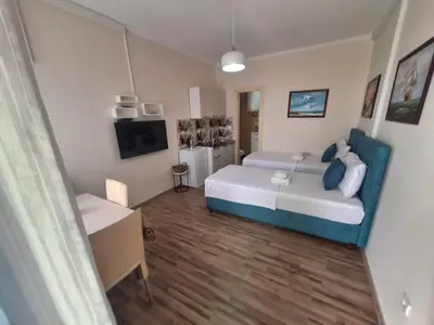 a small room with a bed and a tv at Montesan Luxury Apartment Beach Front in Sveti Stefan