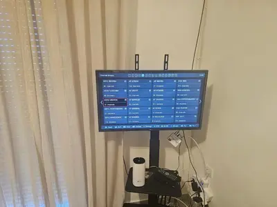 a computer monitor sitting on a stand in front of a window at Apartmani Sabotic in Sutomore