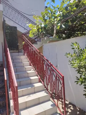 a set of stairs leading up to a house at Studio apartmani Dream Iv in Bar, Susanj