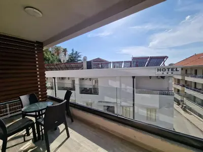 a view from the balcony of a hotel with a table and chairs at Flat Rafailovic One minute to Beach in Budva