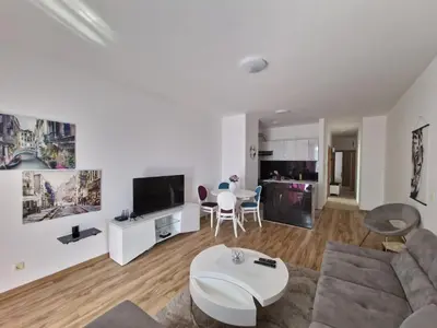 a living room with a couch and a table at Flat Rafailovic One minute to Beach in Budva