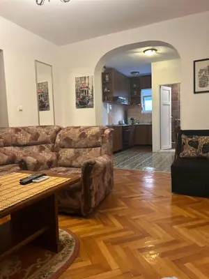 a living room with a couch and a table at Apartmani Vedrana in Sutomore