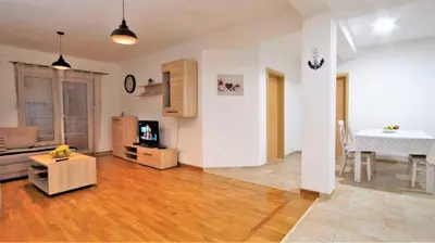 a living room with a couch and a table at Apartment Nia in Budva
