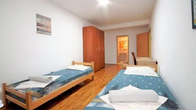 a bedroom with two beds in a room at Apartment Nia in Budva