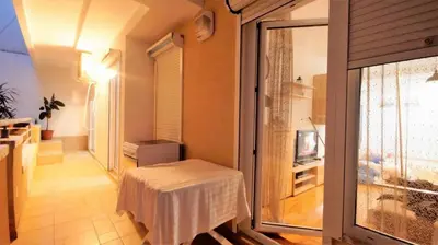 a small room with a table and a window at Apartment Nia in Budva