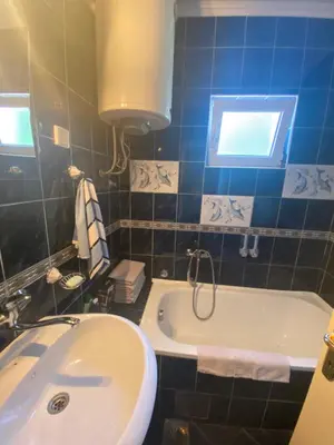 a bathroom with a white tub and a sink at Skadar Lake Apartment -Karolina in Vranjina