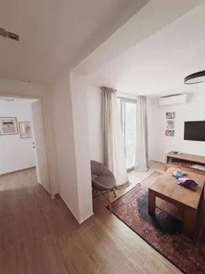 a living room with a table and a chair at Once Upon a Time in Montenegro in Sutomore