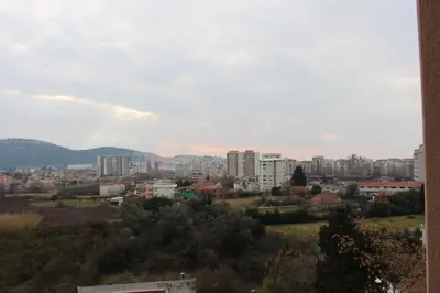 a view of a city with buildings and trees at Jelena apartment Bar in Bar