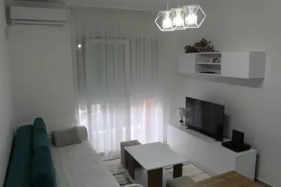 a living room with a couch and a television at Jelena apartment Bar in Bar