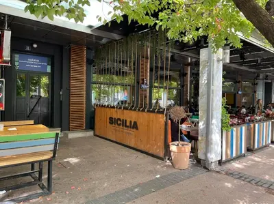 a store with a bench in front of a building at Moderan Studio na Trgu Republike - Centar in Podgorica