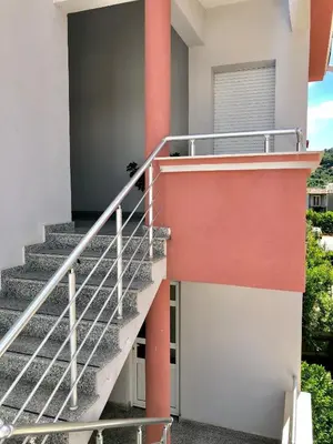 a set of stairs leading up to a house at Apartments Ela in Ulcinj