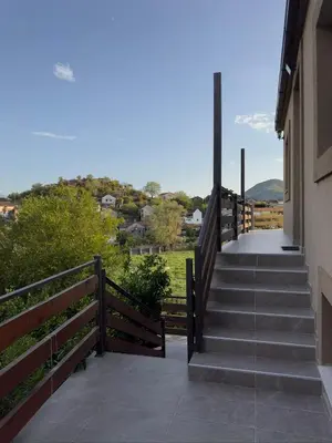 a staircase leading to a house with a fence at Casa di Kiara, Skadar Lake in Dodoši