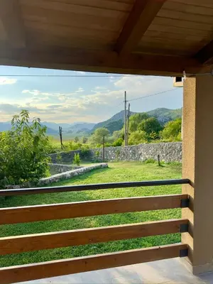 a view from the porch of a house with a fence at Casa di Kiara, Skadar Lake in Dodoši