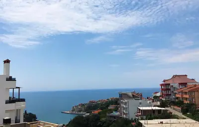 a view of the ocean from a city at Apartments Delfin in Ulcinj