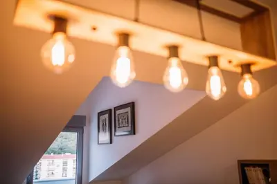 a row of lights hanging from a ceiling at MT One-bedroom boho apartment, Budva in Budva